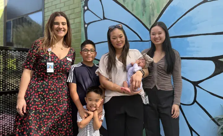 Midwives Dani Gashi and Nhu Trang with mum Trang and kids Connor Spencer and Willow